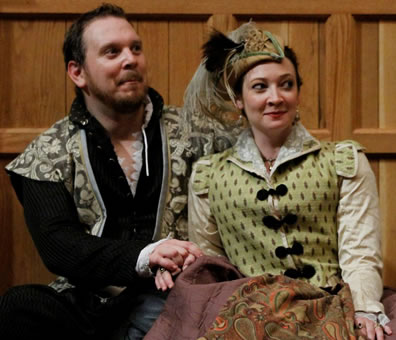 Petruchio and Kate at her sister's wedding banquet in colorful Elizabethan costumes