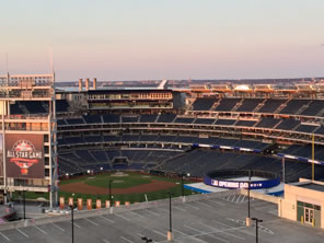 Photo of Nationals Park, with logo of All Star Game and sign flashing Opening Day