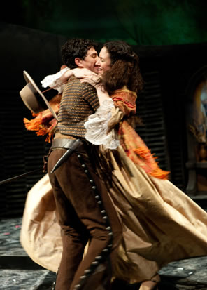 Romeo picks up Juliet in a swirling hug.