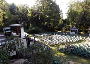 Photo from above of theater and seats in meadow among trees