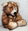 Teddy bear sitting on sofa